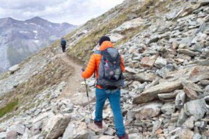 Mountaineer descending from the Tracuit hut, weak and exhausted Mountaineer descending from the Tracuit hut, weak and exhausted